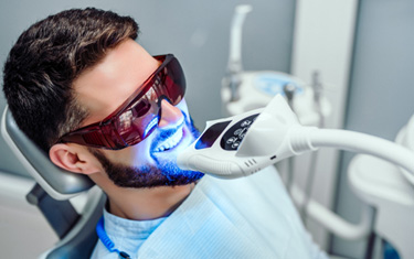 Person receiving in-office teeth whitening 