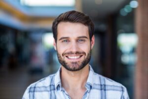 Man smiling with an aesthetic set of teeth