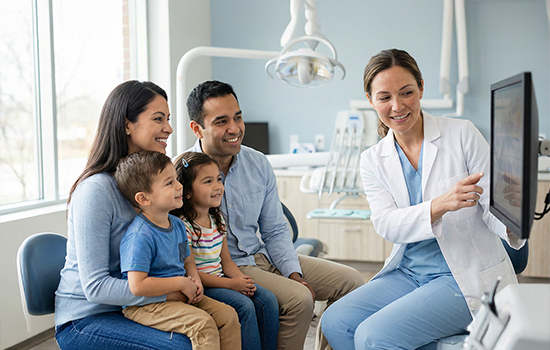 Dentist and assistant performing a dental procedure on a patient